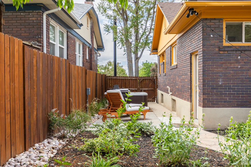Fenced backyard featuring central AC