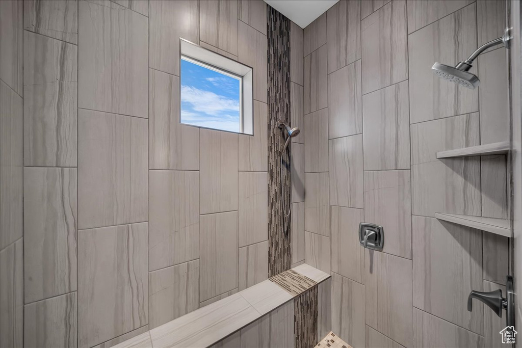 Bathroom with tiled shower