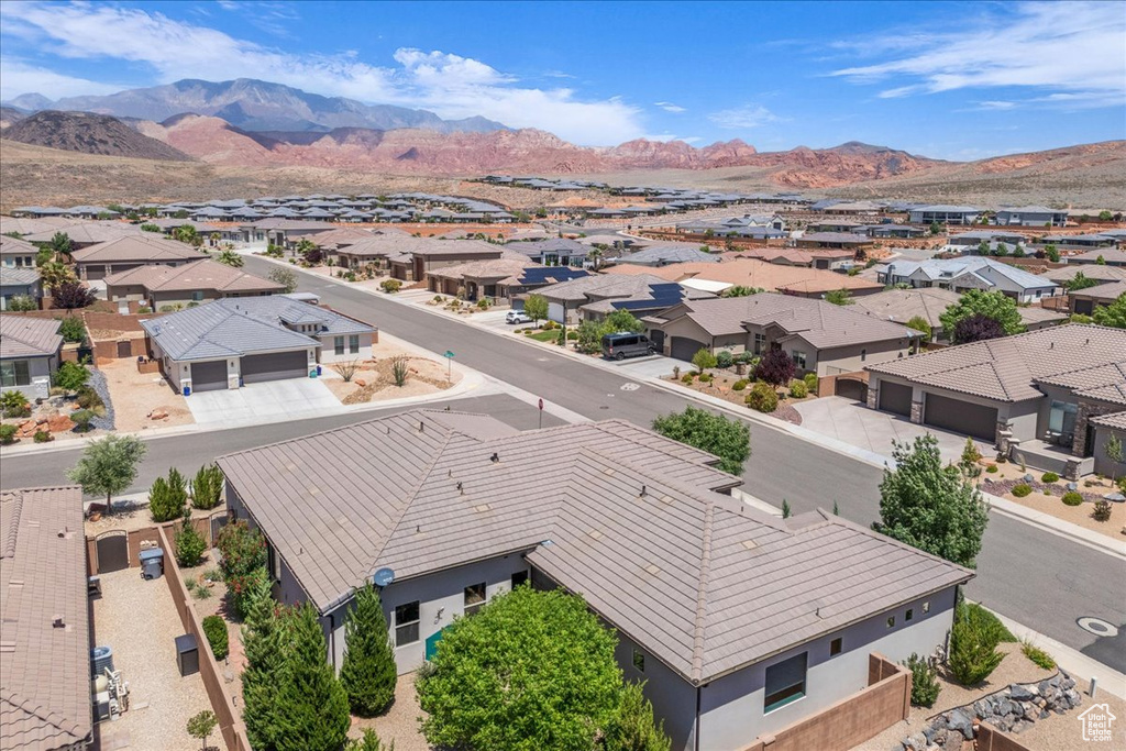 Aerial perspective of suburban area with a mountain backdrop