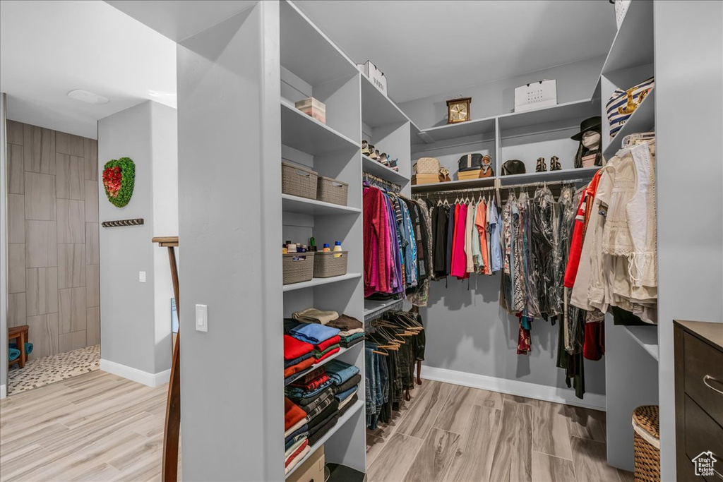Walk in closet featuring wood finished floors