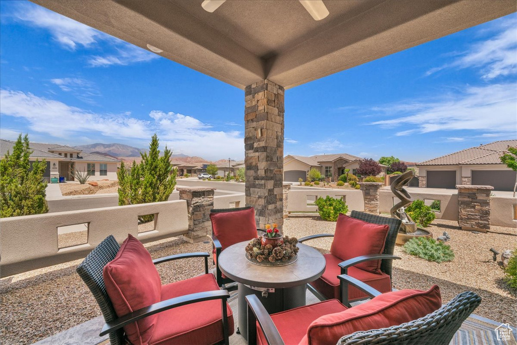 View of patio / terrace featuring ceiling fan, a residential view, and outdoor dining space