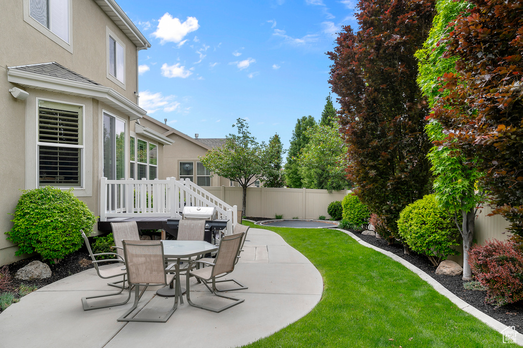 View of patio with outdoor dining space