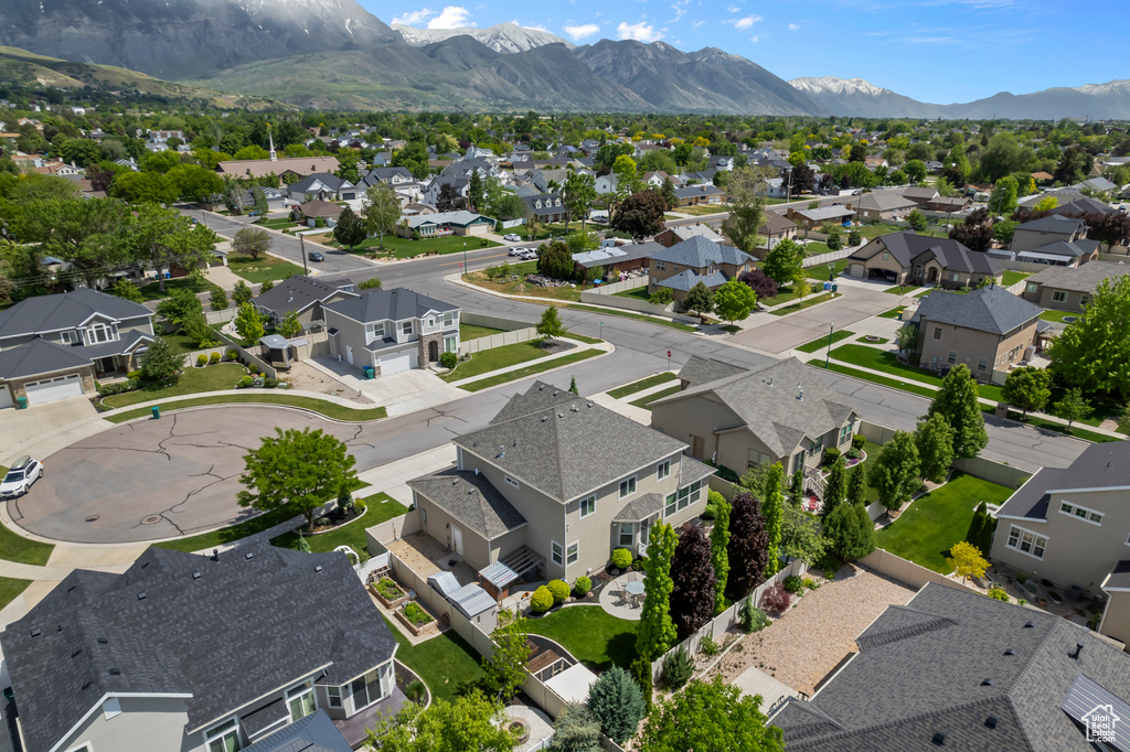 Aerial perspective of suburban area featuring a mountainous background