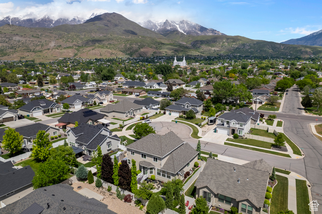 Aerial view of residential area featuring a mountain backdrop