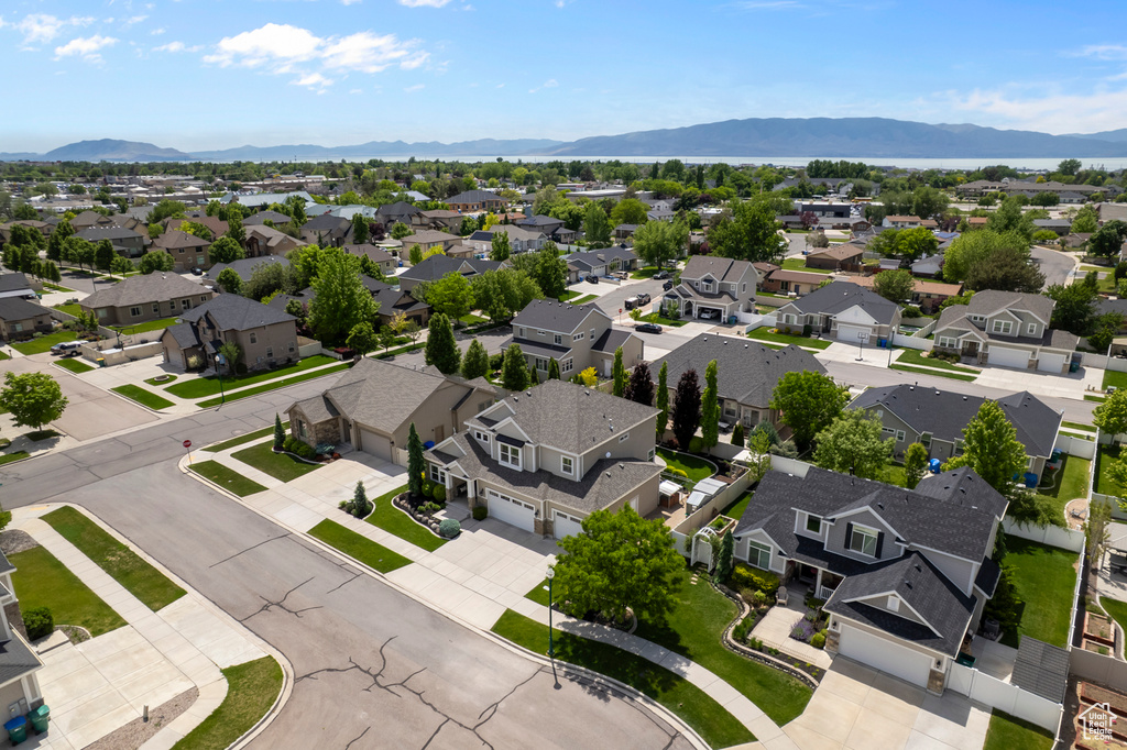 Aerial perspective of suburban area with a mountainous background