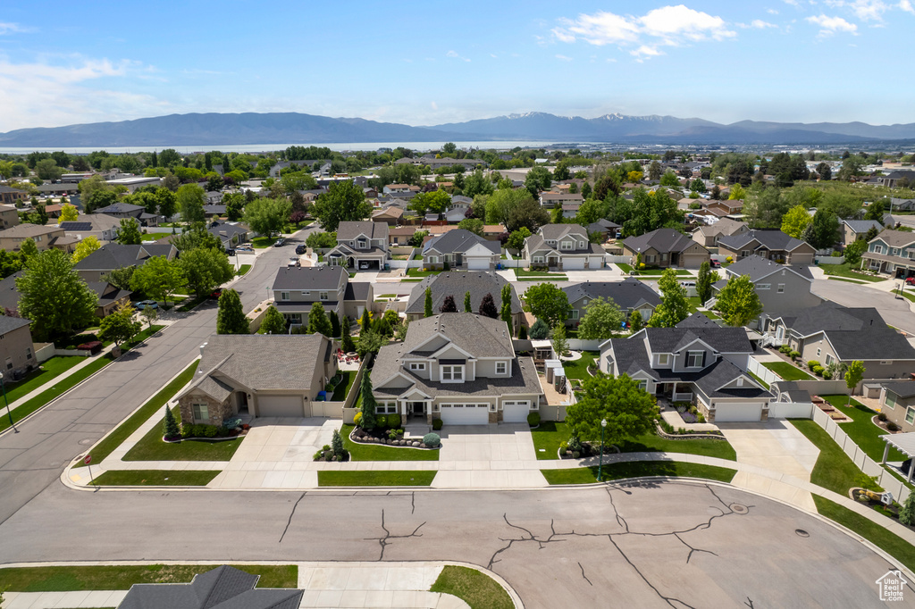 Aerial perspective of suburban area featuring a mountainous background