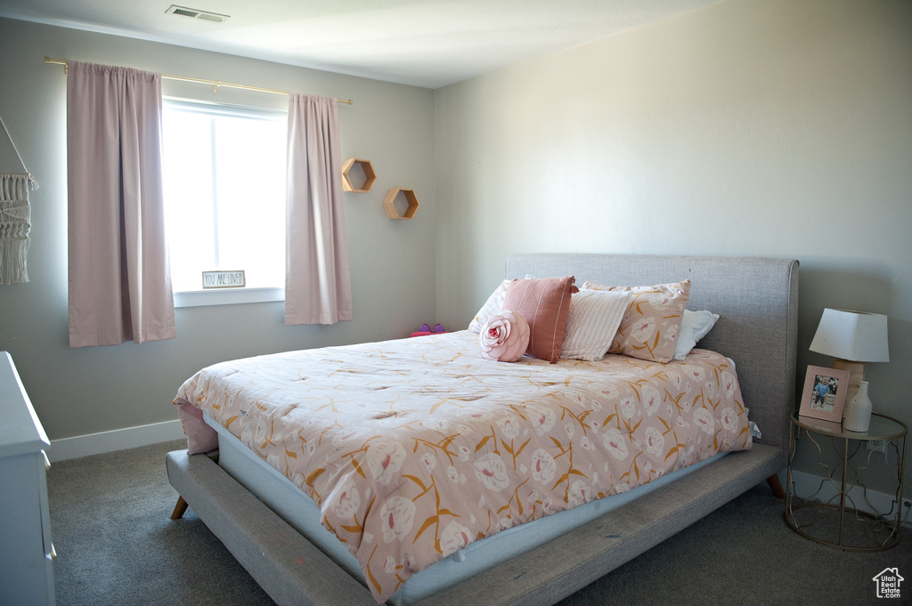 Bedroom with carpet and baseboards