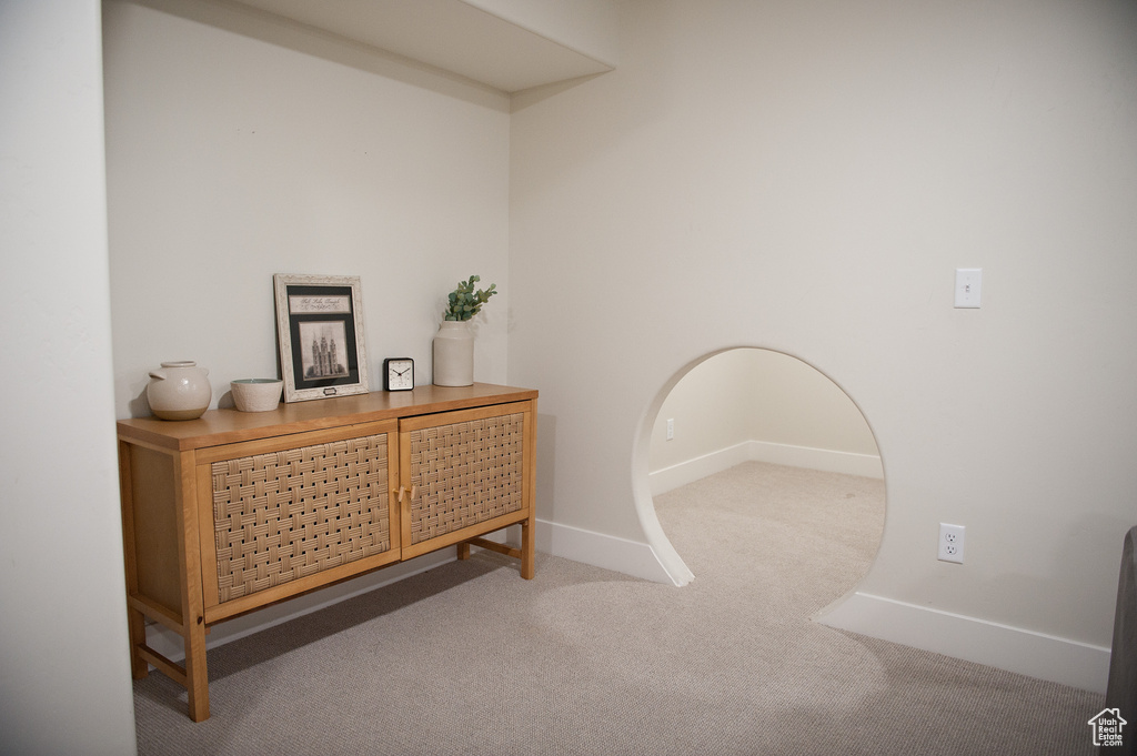 Carpeted office space featuring baseboards