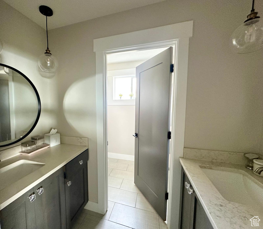 Bathroom with vanity and tile patterned floors