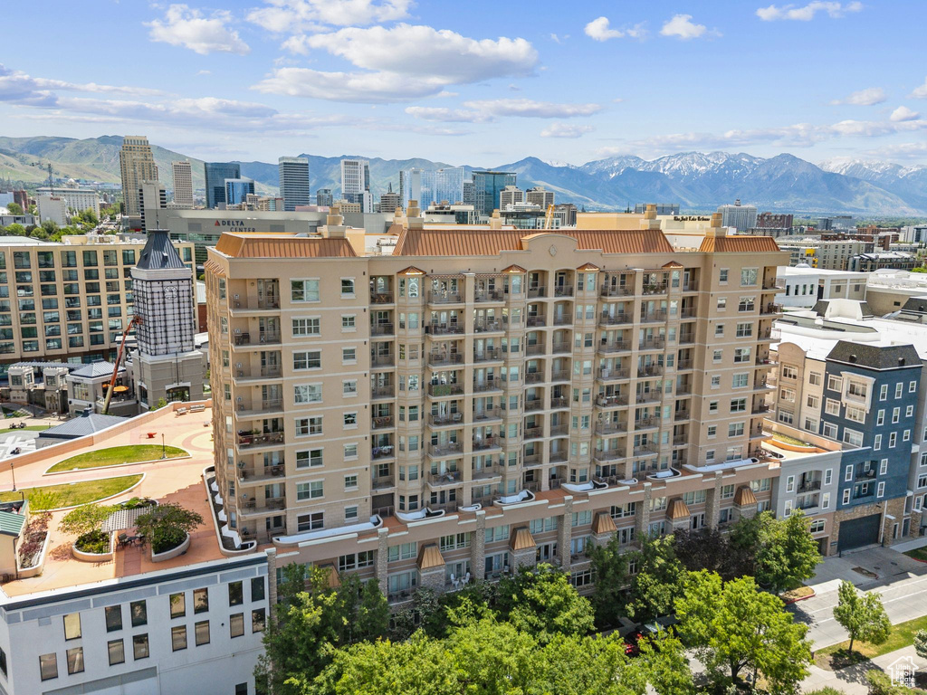 View of apartment building / complex with a mountain view and a city view