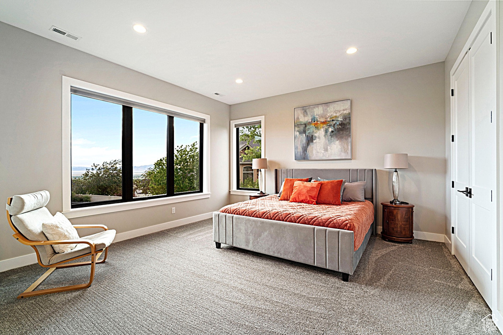 Carpeted bedroom featuring recessed lighting and baseboards