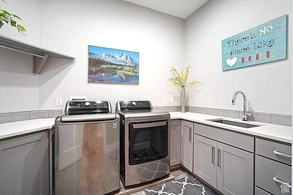 Clothes washing area with independent washer and dryer and cabinet space