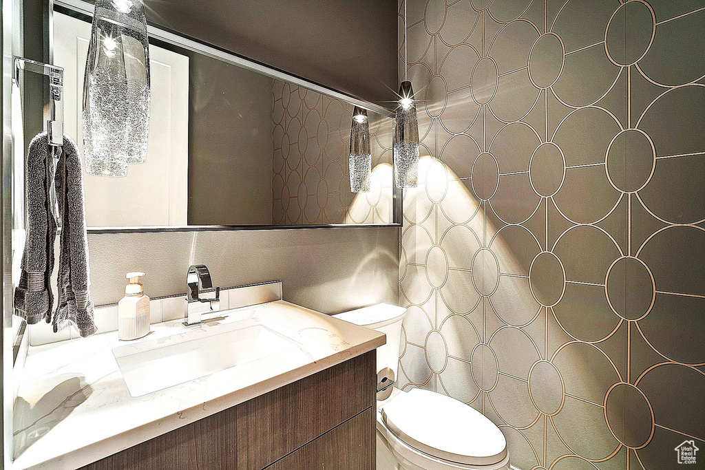 Bathroom featuring toilet and vanity