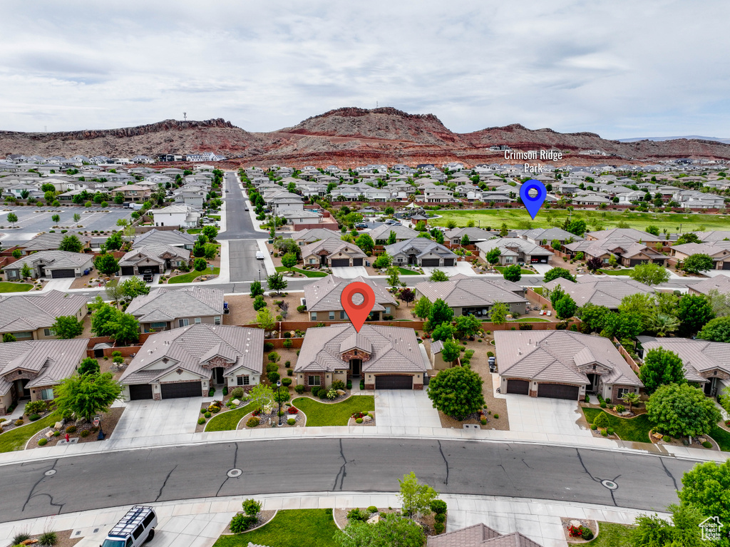Aerial perspective of suburban area with a mountain backdrop