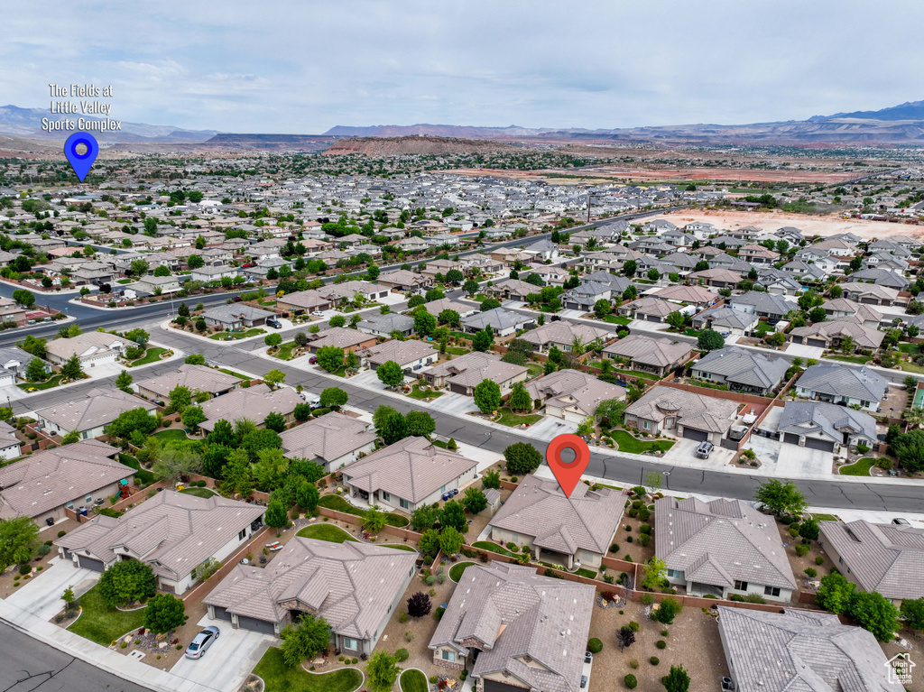 View of property location with a mountain backdrop and nearby suburban area