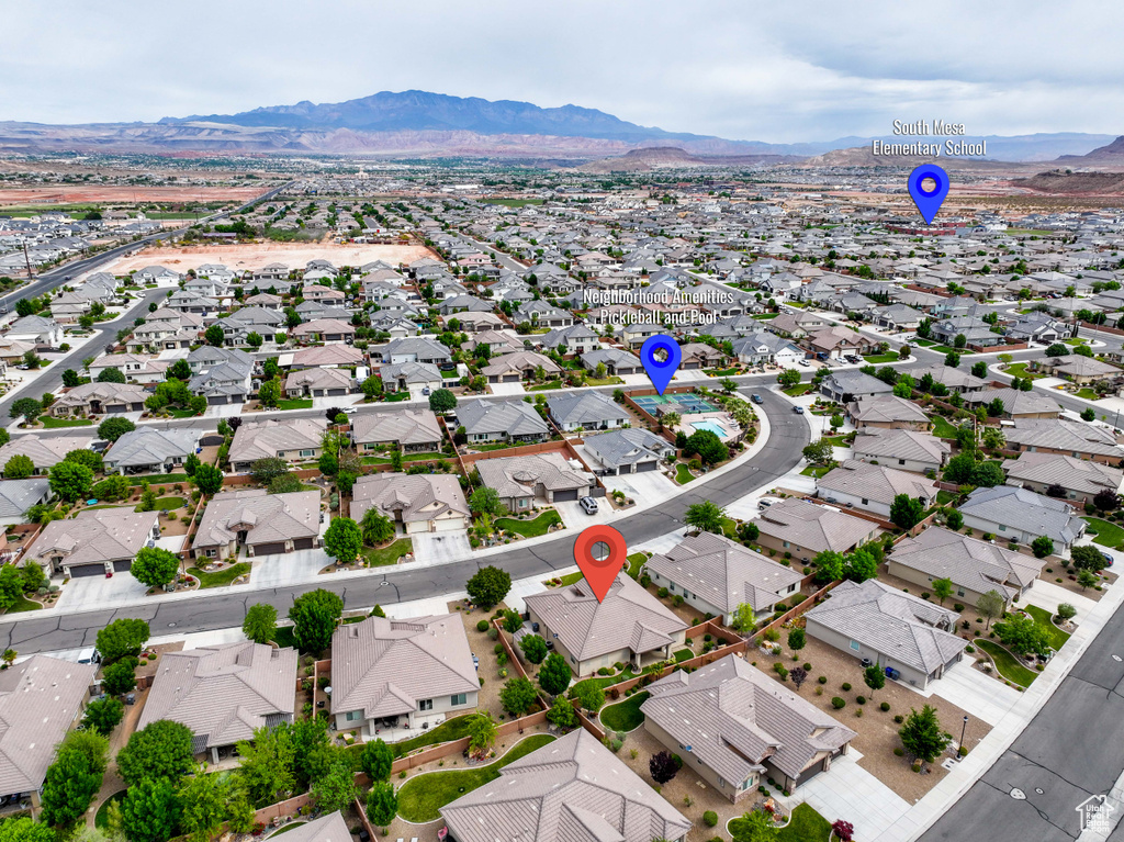 Aerial view of residential area with a mountain backdrop