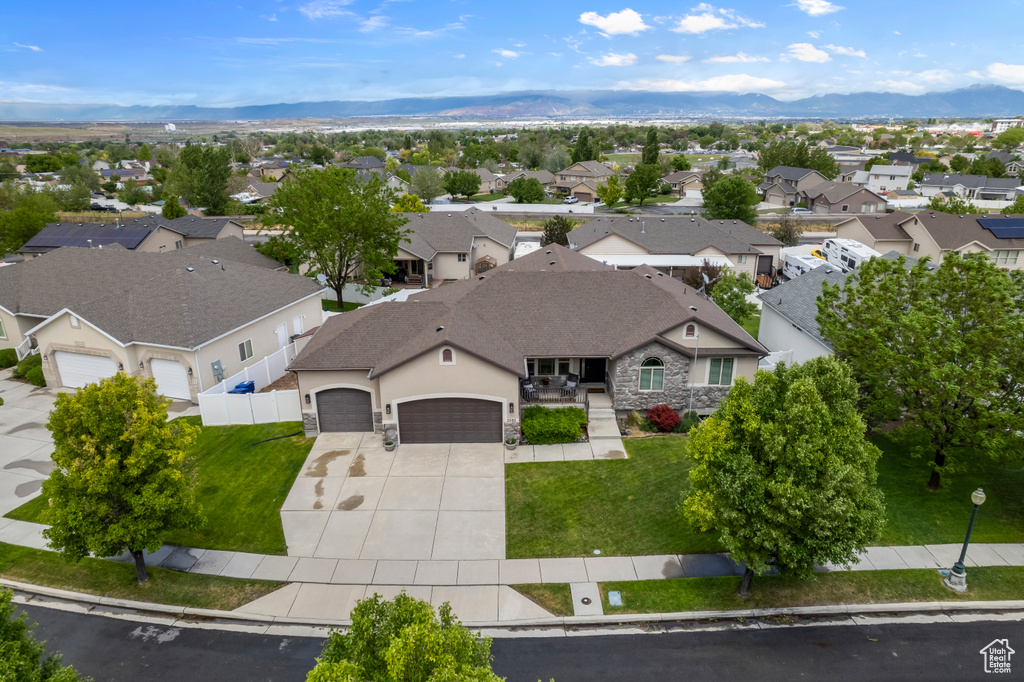 Aerial perspective of suburban area featuring a mountainous background
