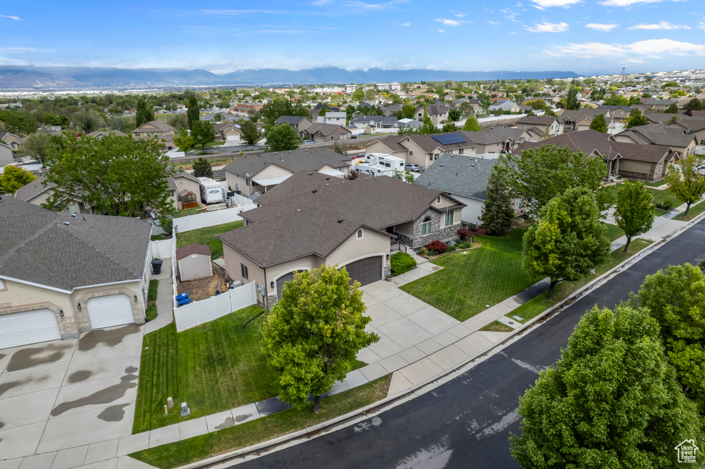 Aerial view of residential area featuring mountains