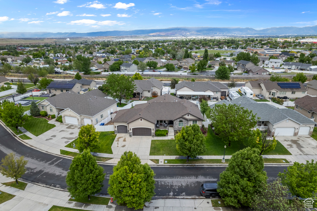 Aerial perspective of suburban area with a mountainous background