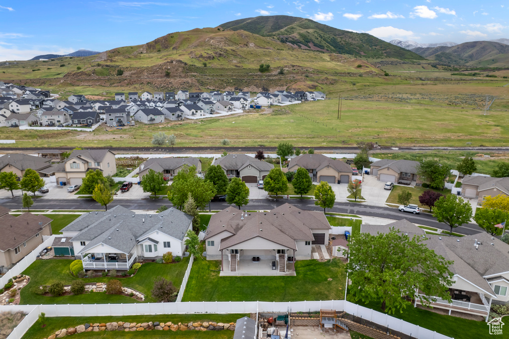 Aerial perspective of suburban area featuring a mountainous background