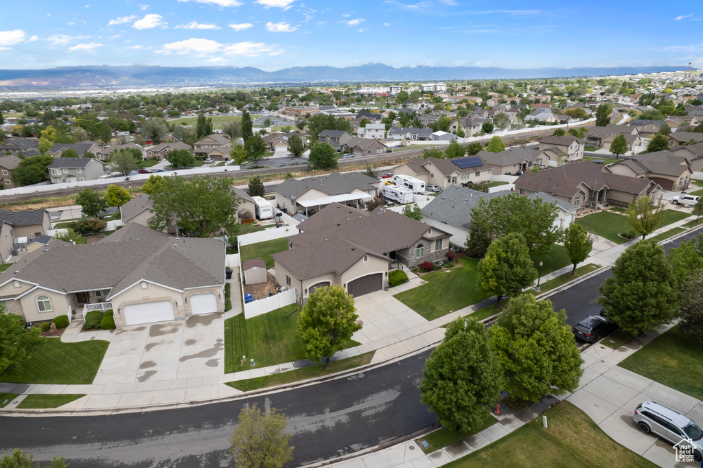 Aerial perspective of suburban area featuring a mountainous background