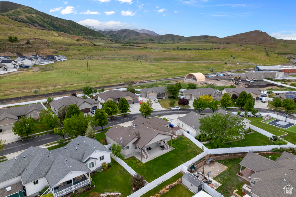 Aerial view of residential area featuring a mountain backdrop
