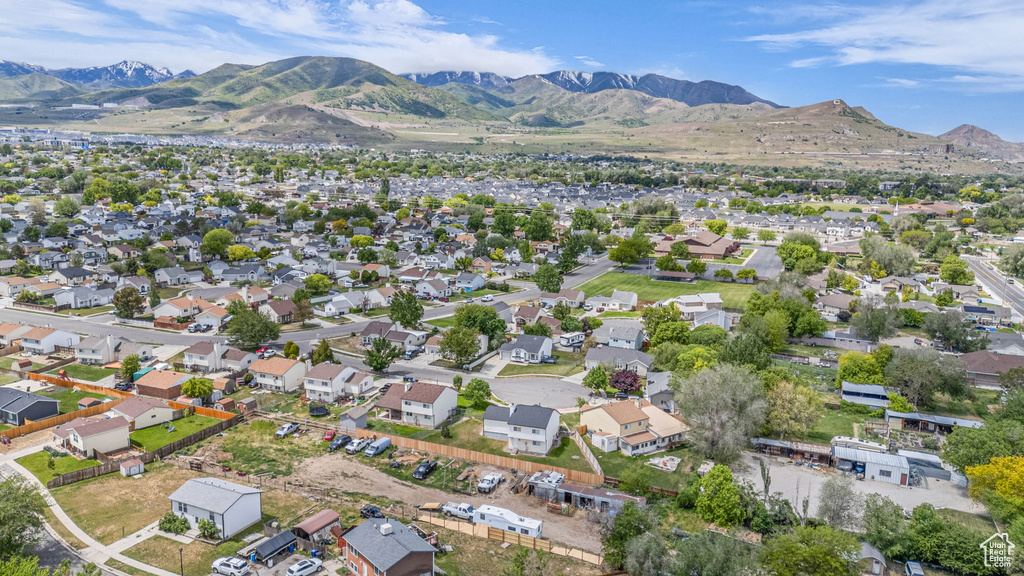 Aerial perspective of suburban area featuring a mountain backdrop