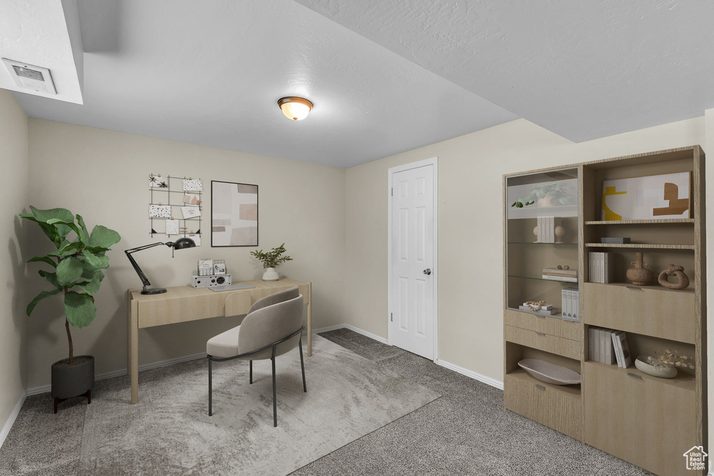 Office space with carpet floors and baseboards