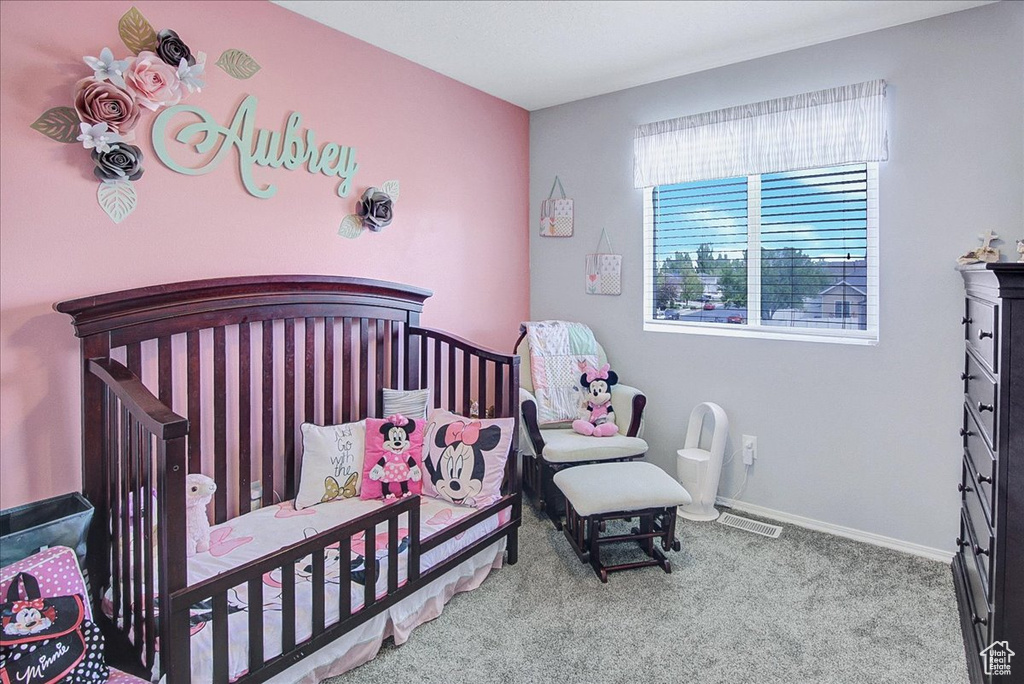 Carpeted bedroom with baseboards