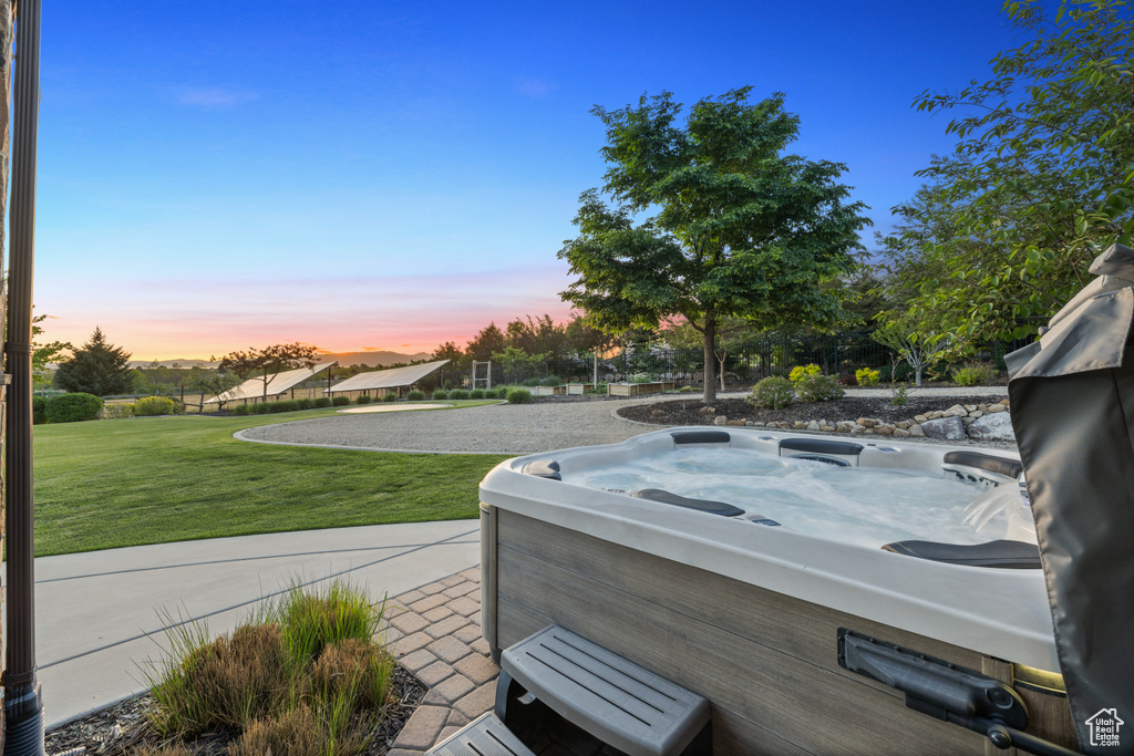 View of patio / terrace with a hot tub