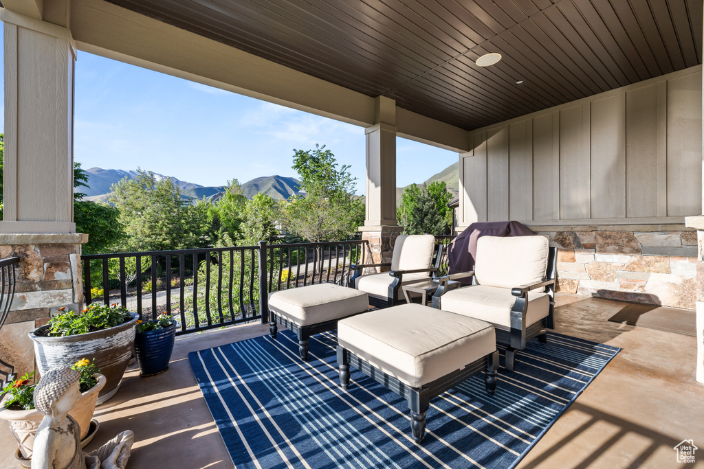View of patio / terrace featuring a mountain view and a balcony