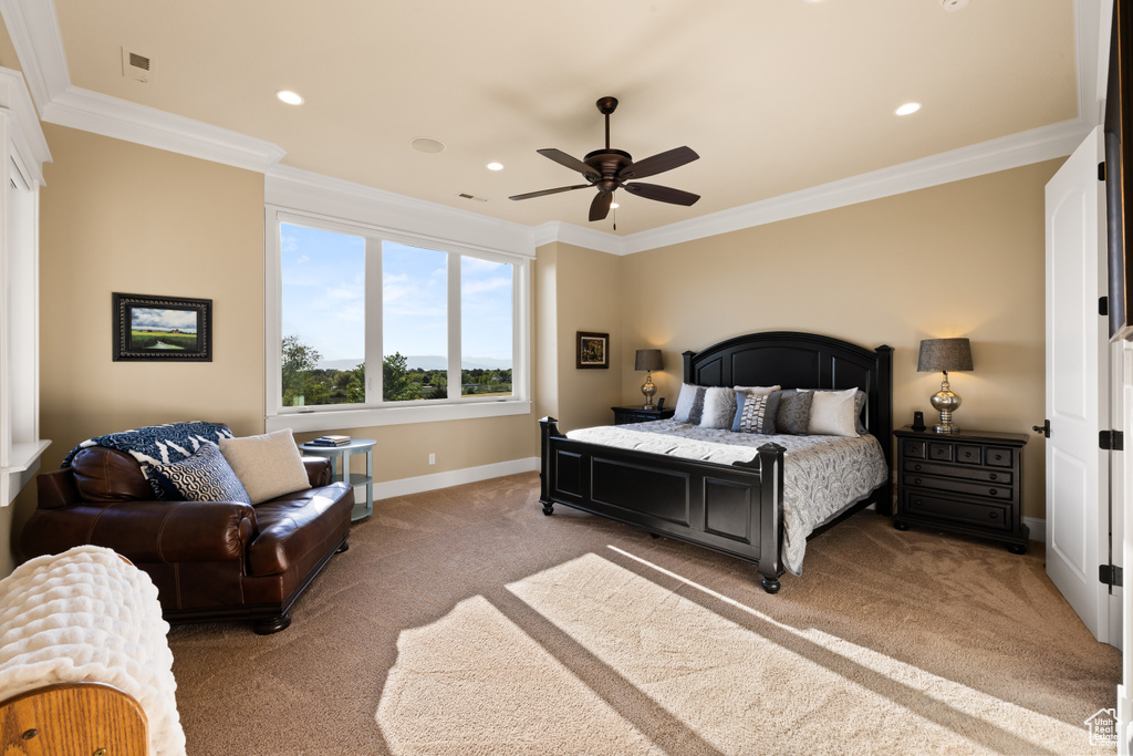 Bedroom with light carpet, ornamental molding, baseboards, recessed lighting, and ceiling fan
