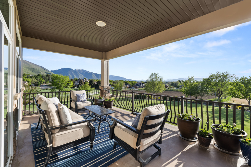 View of patio featuring a mountain view and an outdoor hangout area