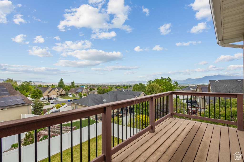 Wooden terrace with a mountain view and a residential view