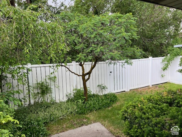 View of yard featuring fence