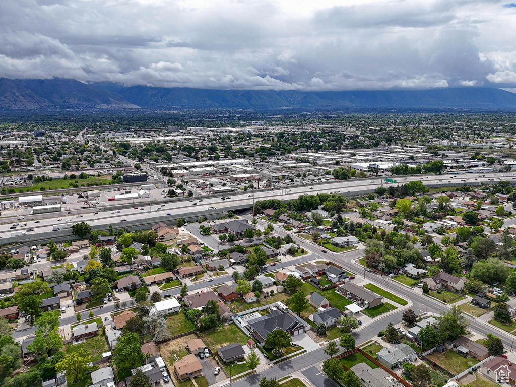 Aerial view of residential area featuring a mountain backdrop