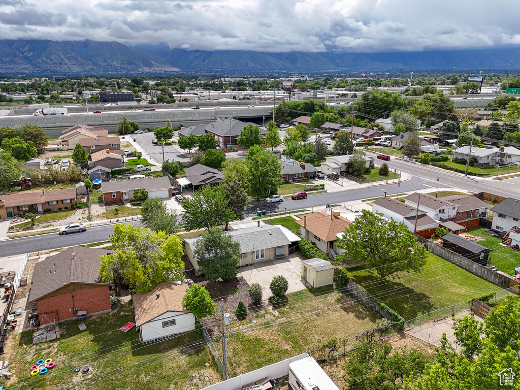 Aerial view of residential area featuring a mountainous background