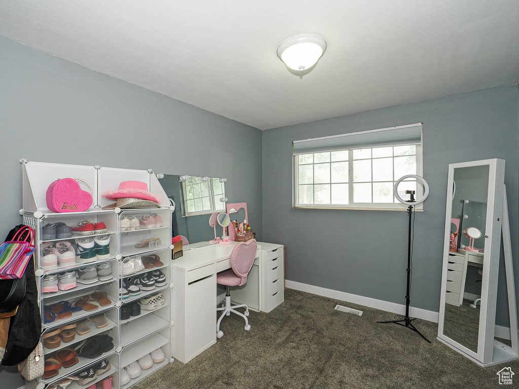 Home office featuring carpet floors and baseboards