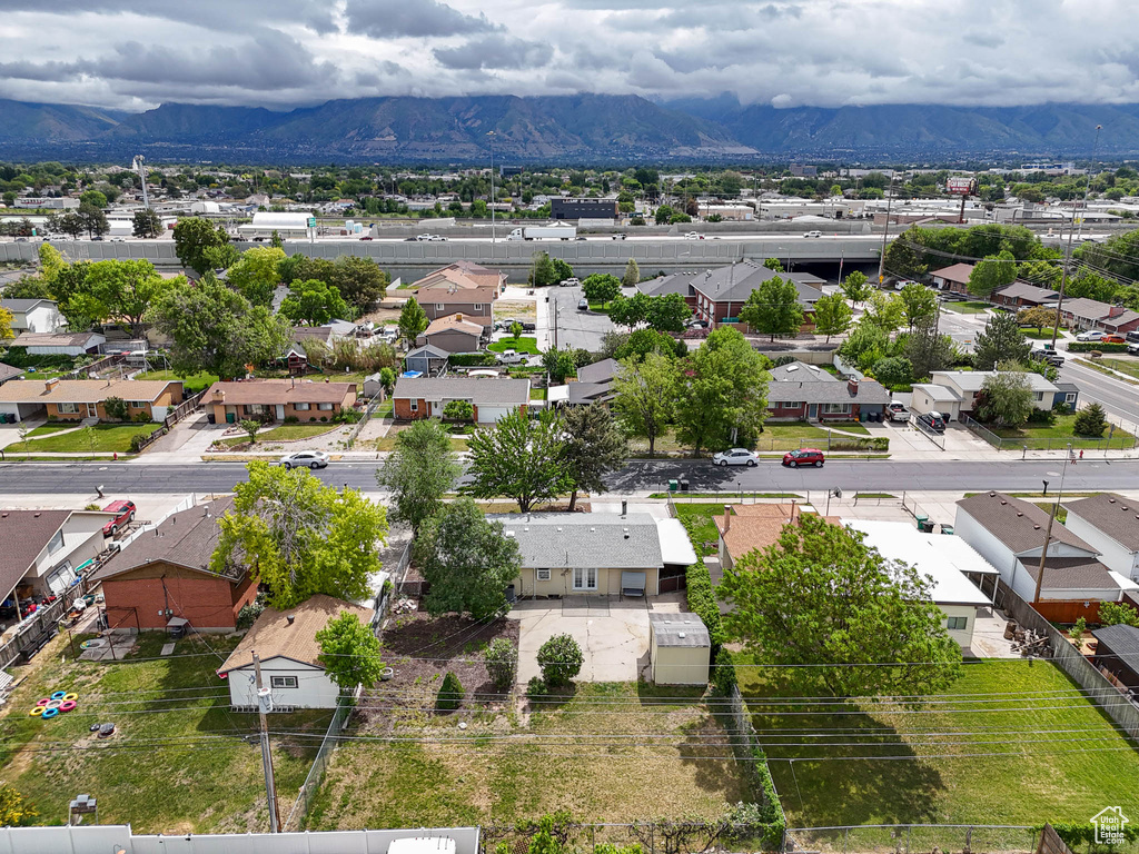 Aerial view of residential area featuring a mountain backdrop
