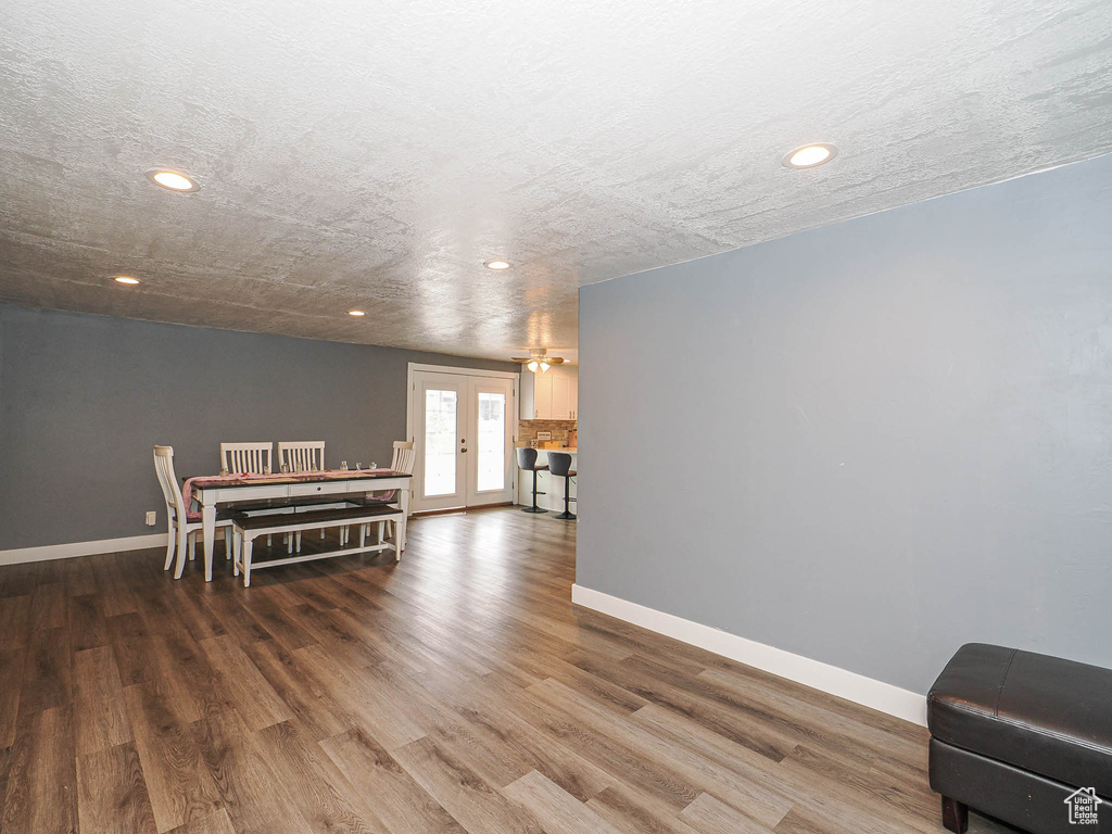 Dining space featuring recessed lighting, wood finished floors, baseboards, and french doors