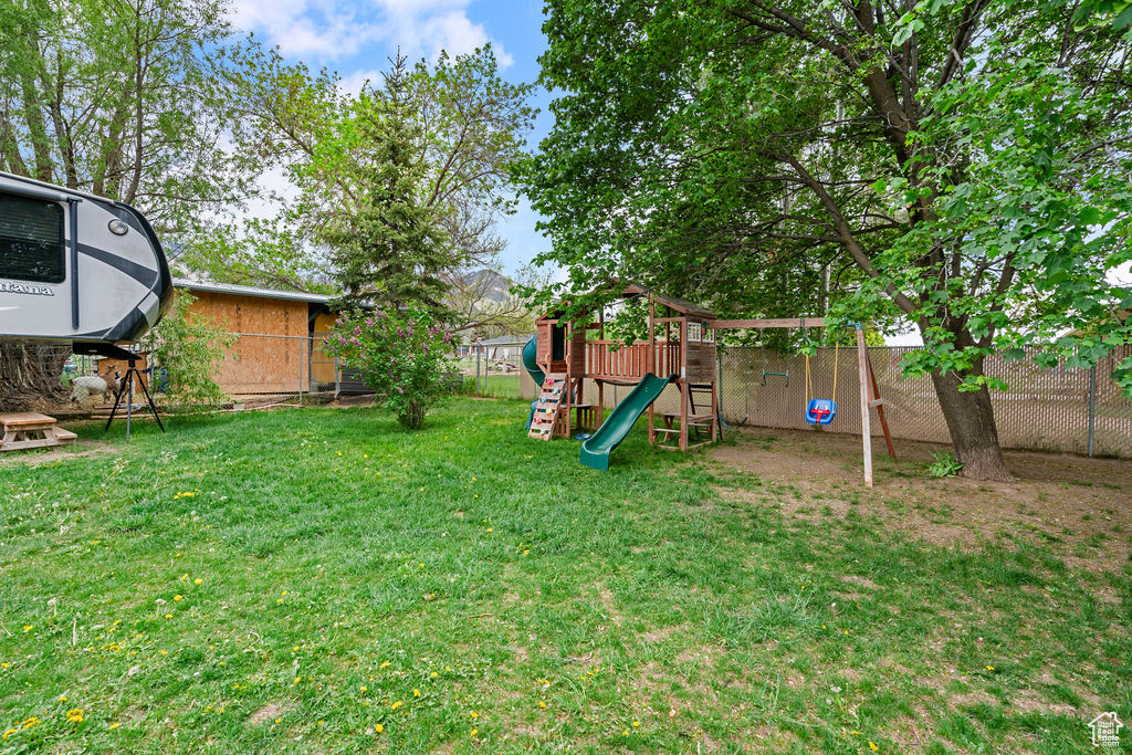 View of yard with a playground