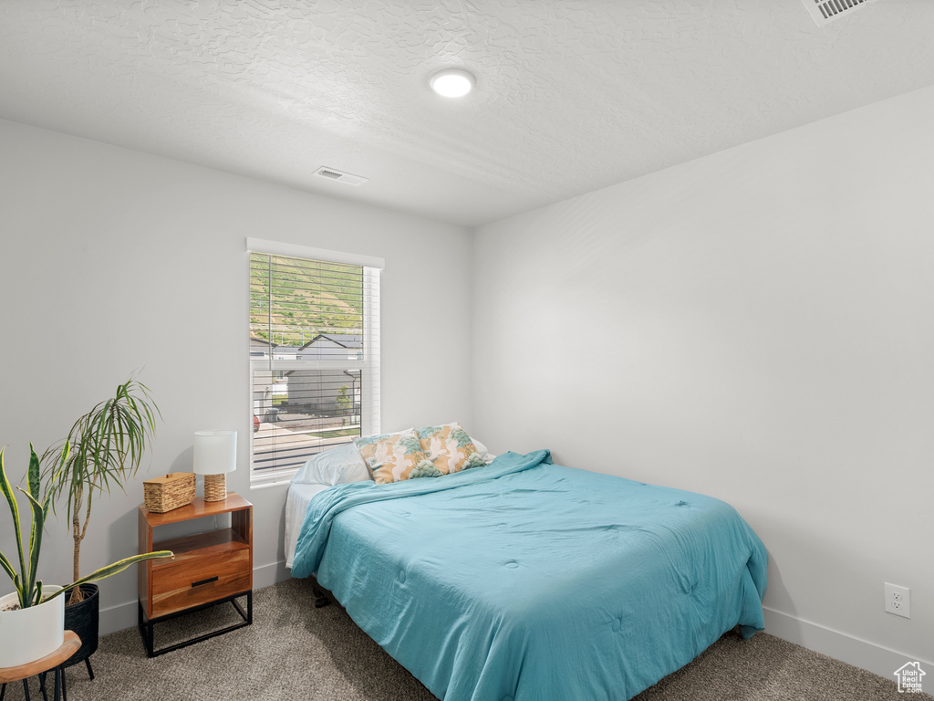 Bedroom with carpet and baseboards