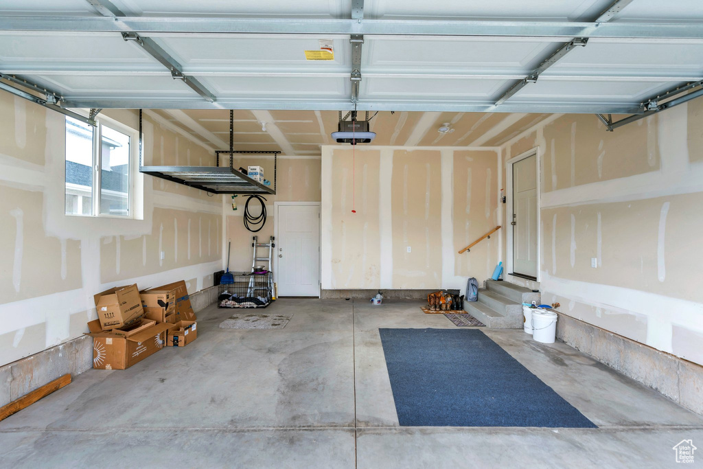 Garage featuring a garage door opener