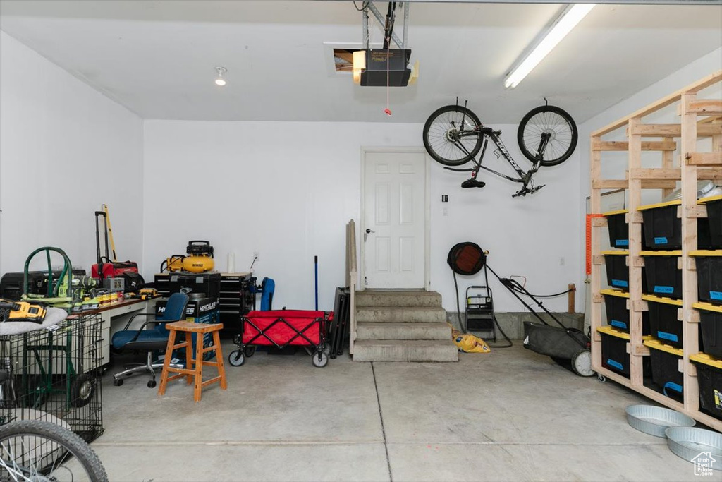 Garage featuring a garage door opener