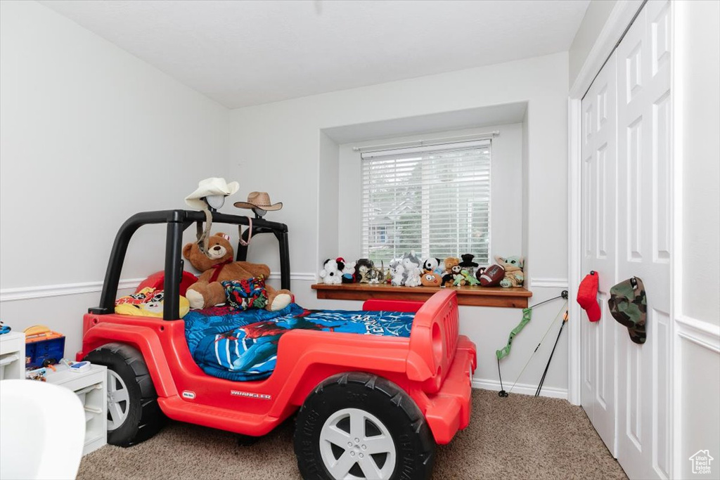Playroom featuring carpet and baseboards