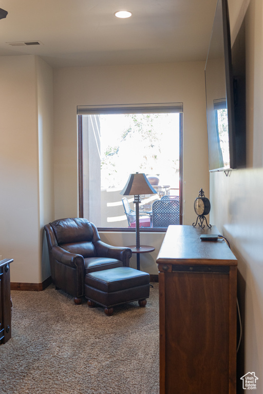 Living area with carpet, recessed lighting, and baseboards