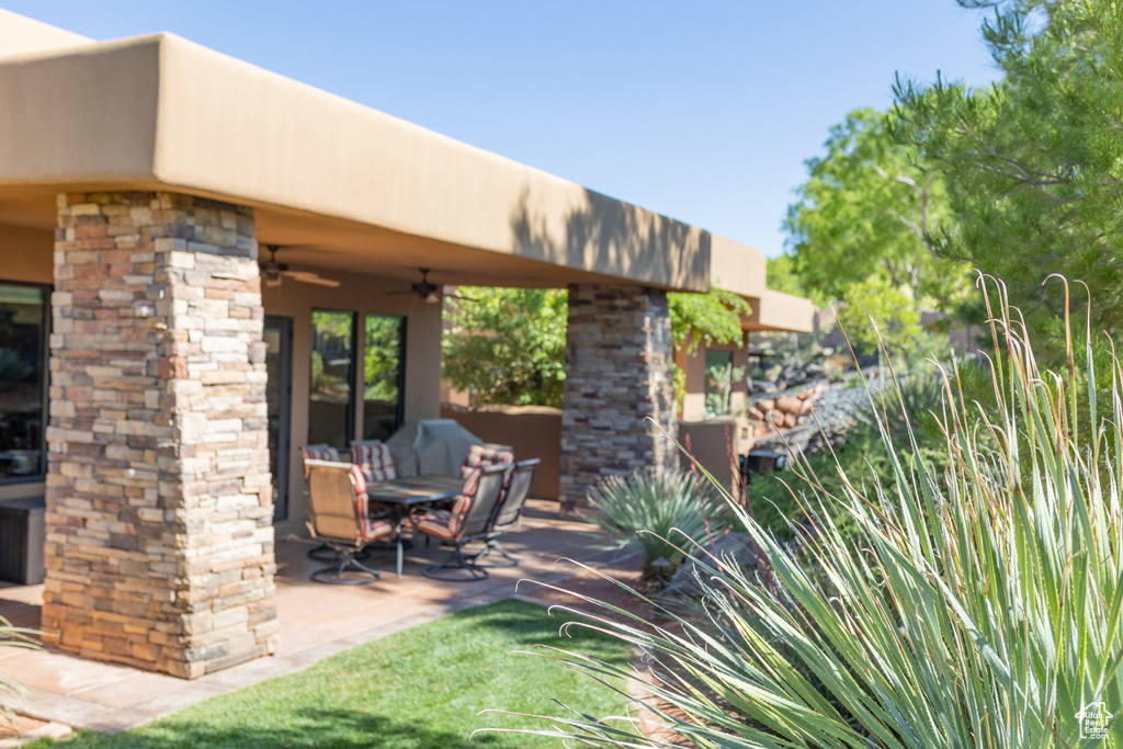 View of patio with ceiling fan