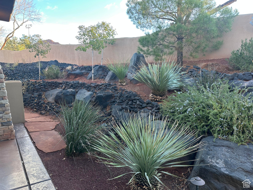 View of yard featuring fence