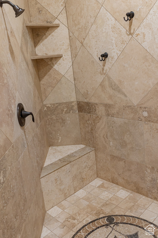 Full bathroom featuring tiled shower