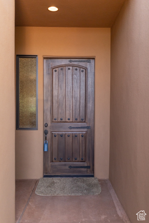 View of exterior entry featuring stucco siding